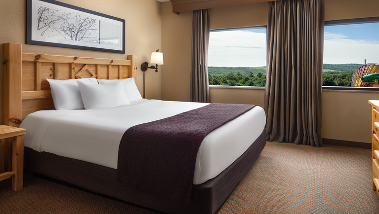 Private master bedroom with King size bed in Royal Wolf Den Suite
